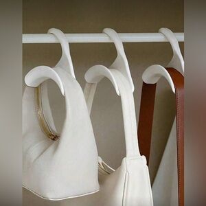 Pack of 4 bag hangers!!! Get as many orders as you need now! They will not last!